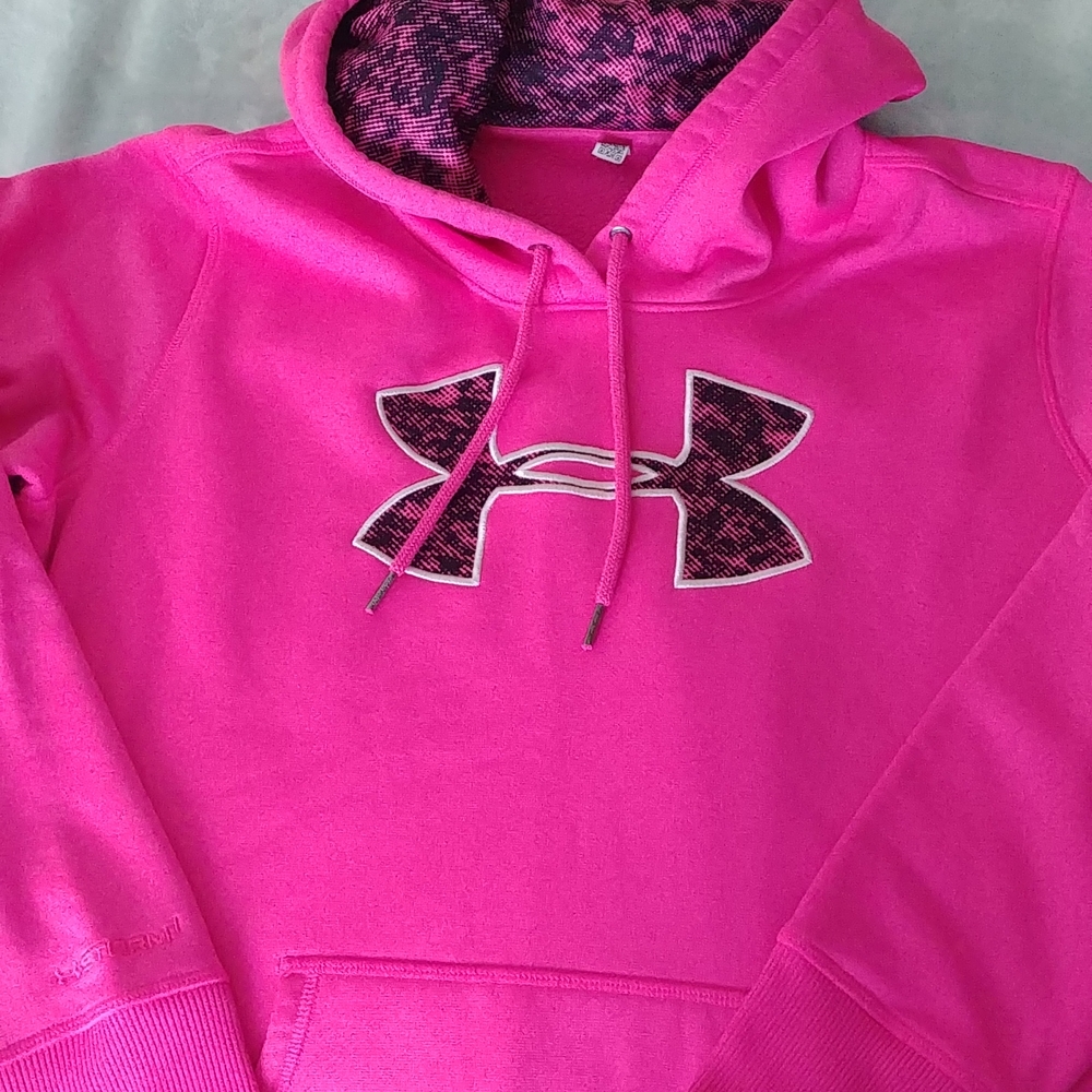 Under Armour hot pink storm hoodie.